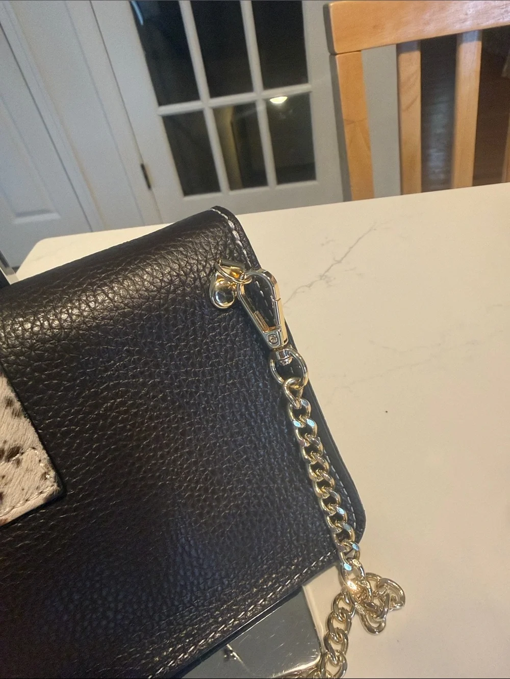 Black Pebbled Leather Crossbody Bag with Speckled Tab and Gold Chain